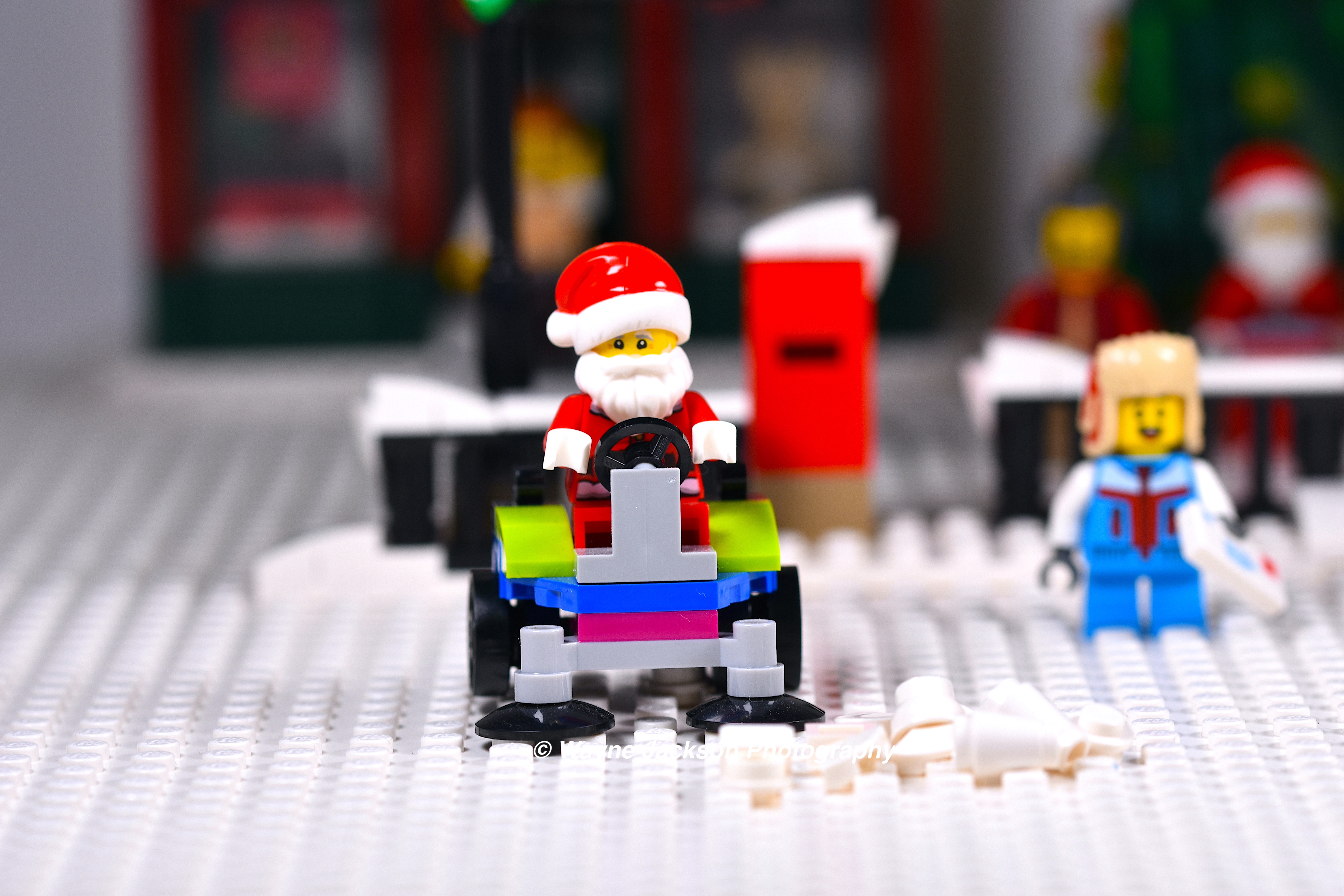 Lego Santa minifigure clearing the snow