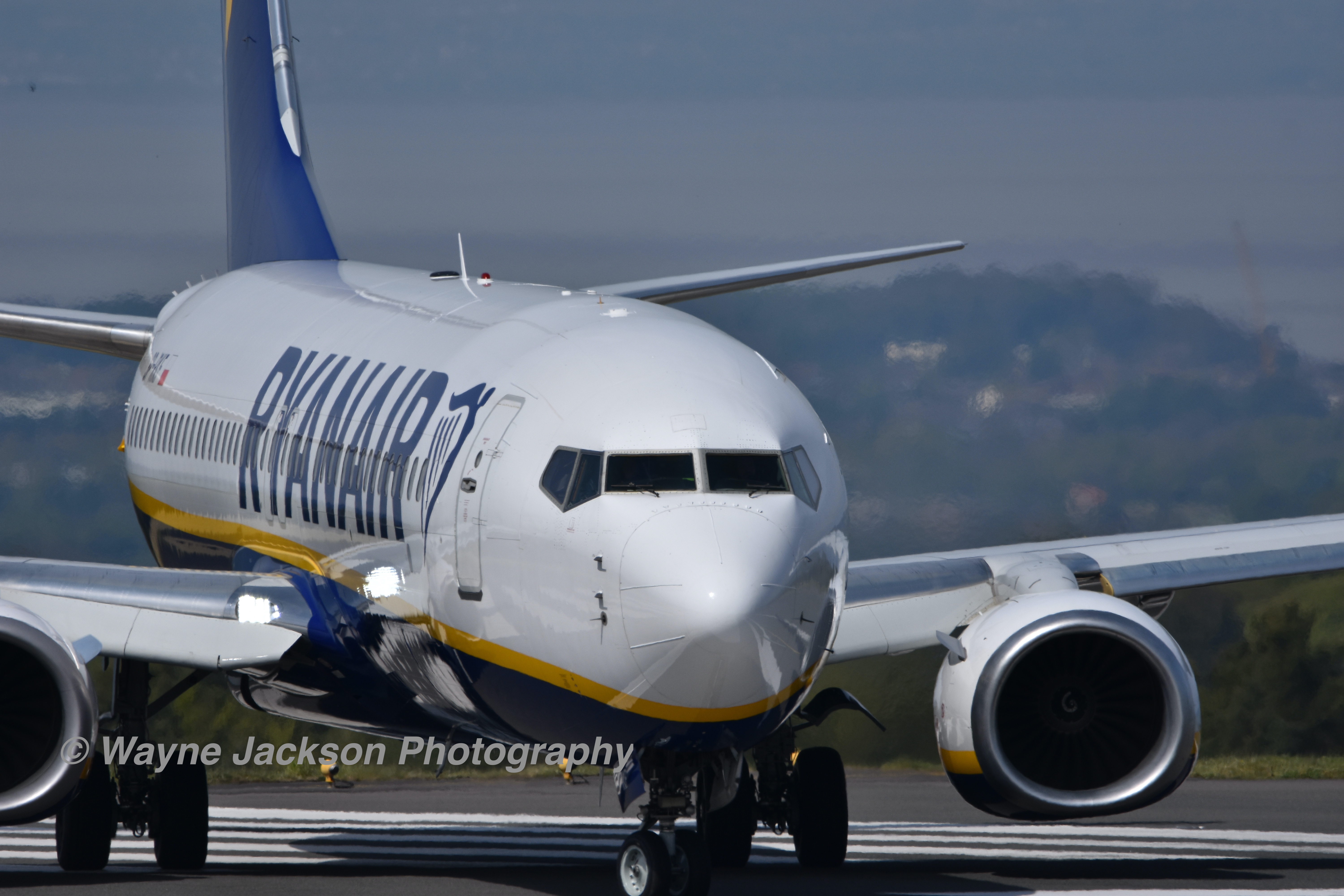 A close up of a Ryanair aeroplane at Bristol Airport about to take off