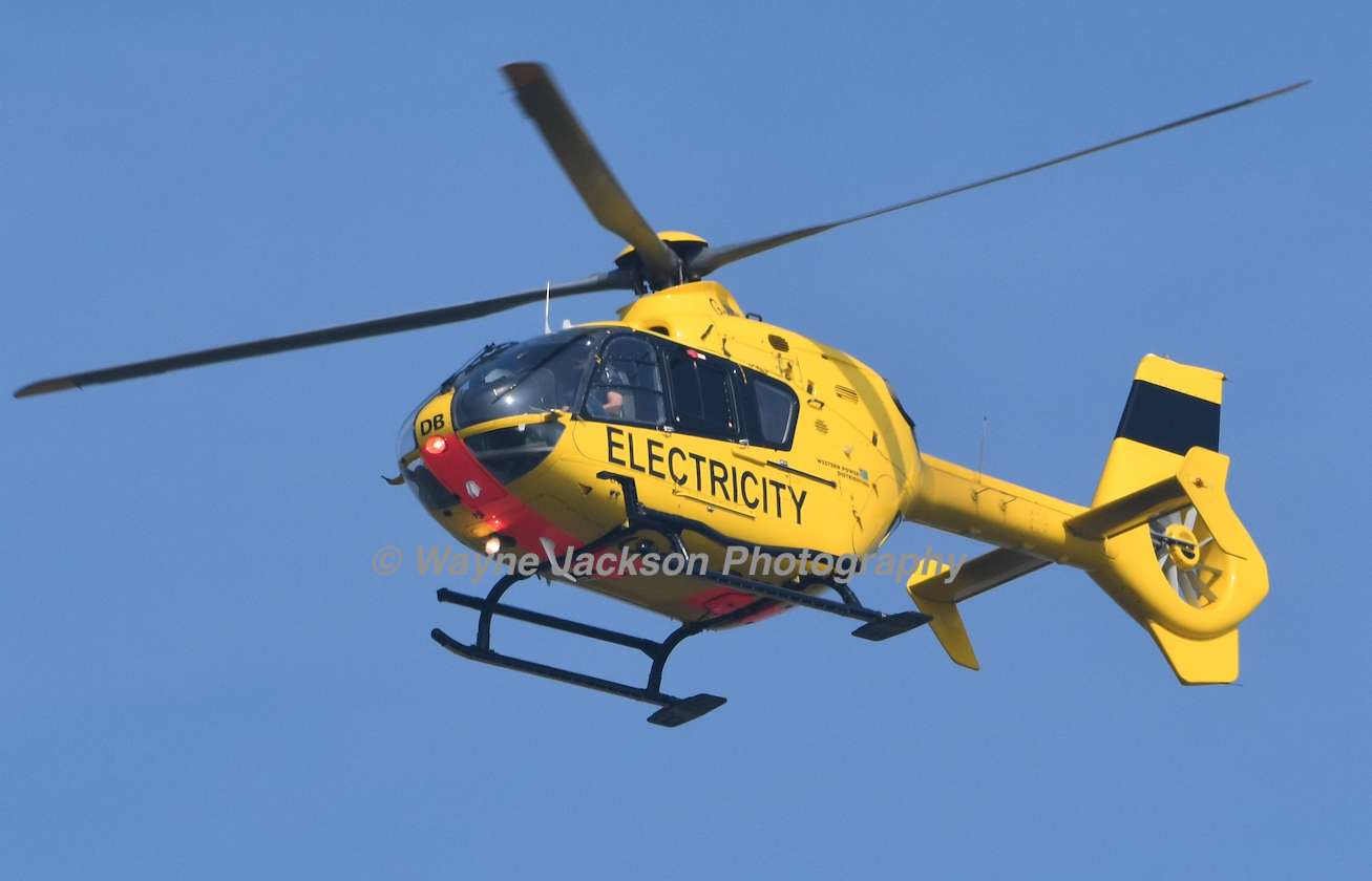 WPD yellow electricity helicopter over Bristol Airport