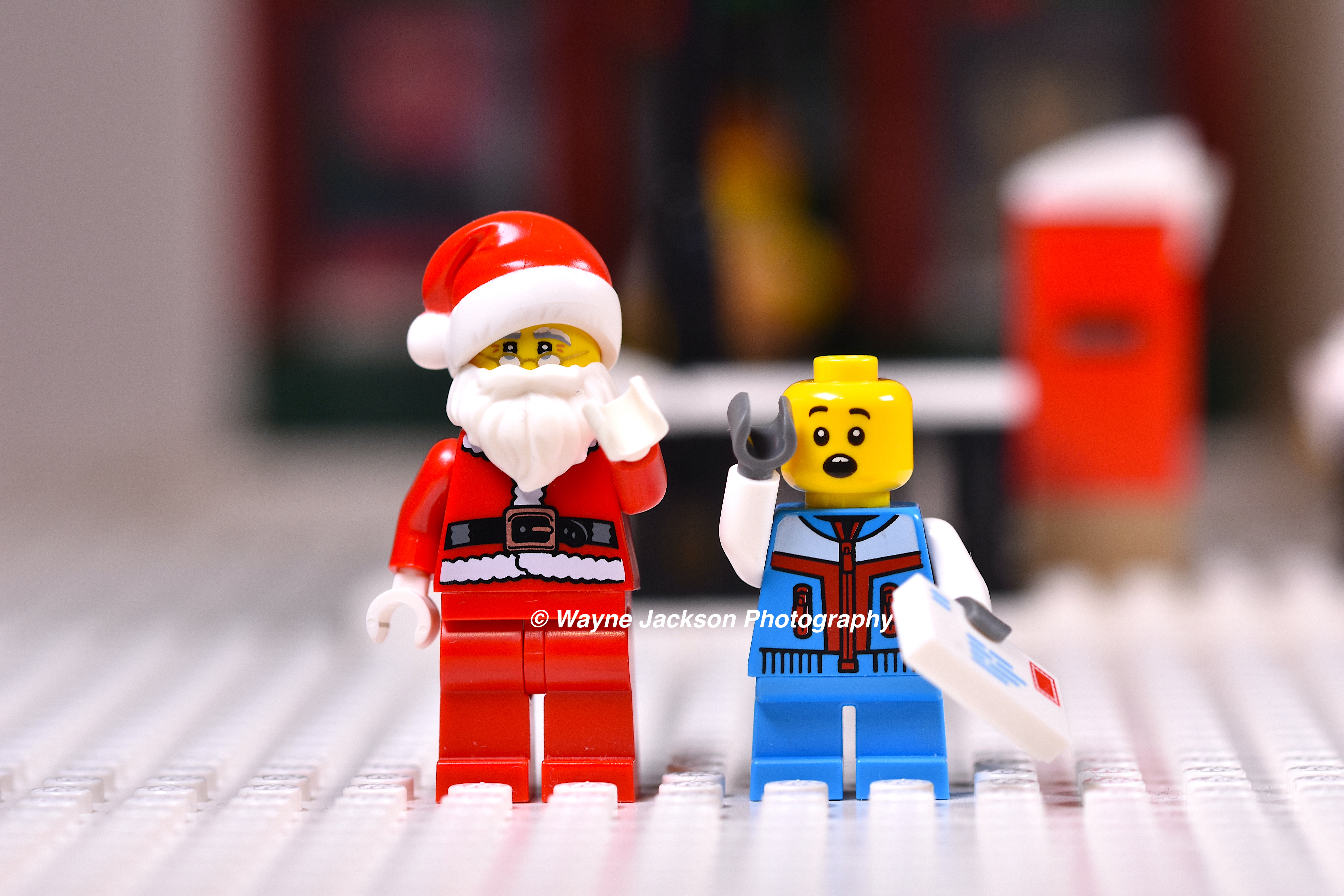 Two Lego minifigures including Santa