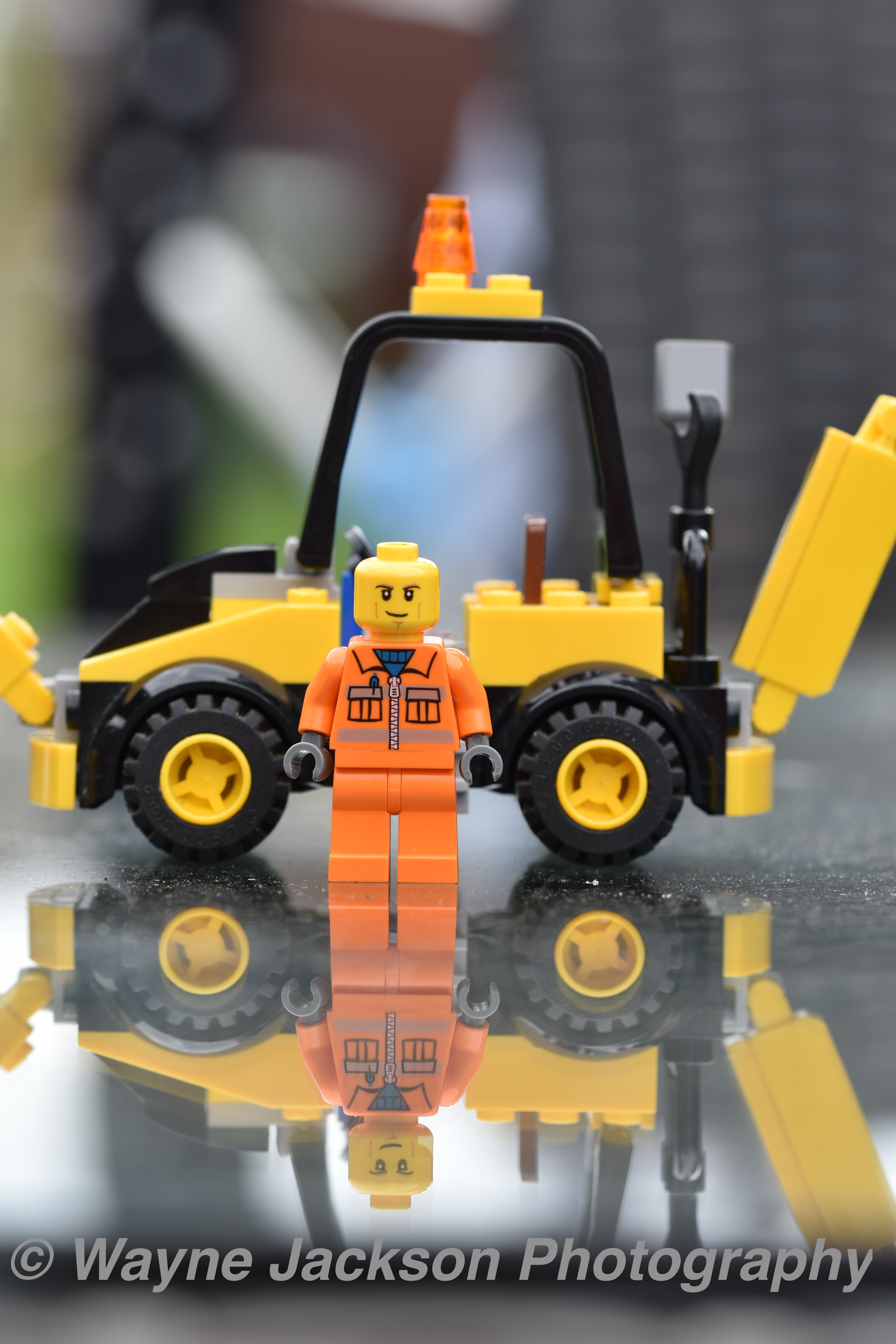 Lego minifigure and digger