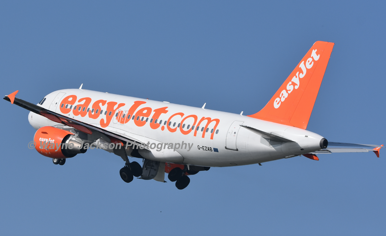 G-EZAB Airbus A319-111 easyJet aeroplane sky blue background